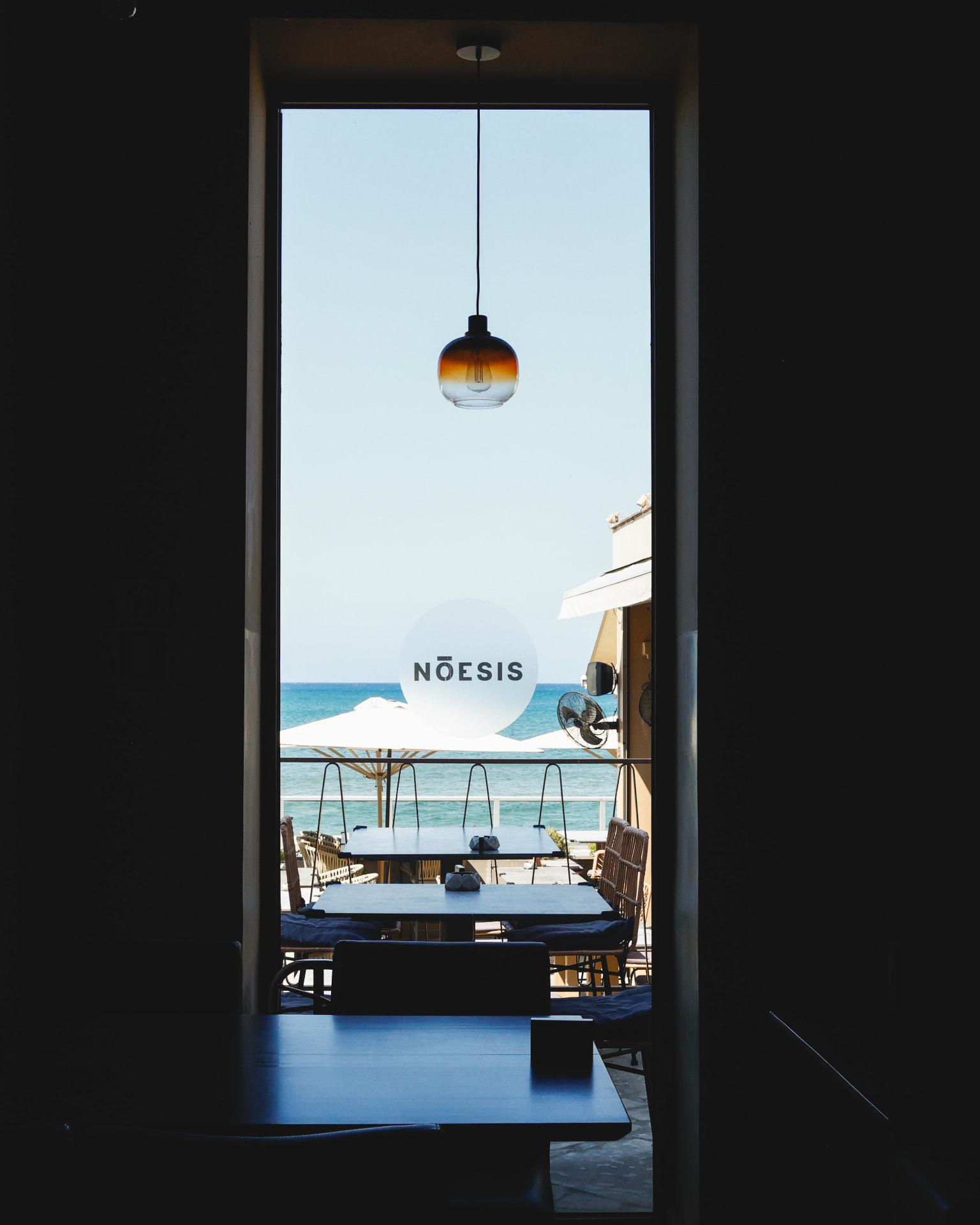 View from the Nōesis dining room to the seafront terrace