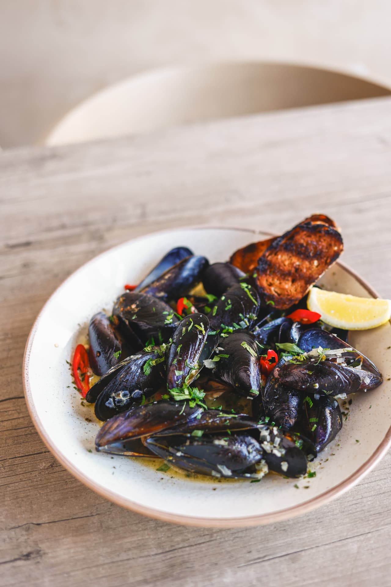 Mussels with herbs and chilli, toasted bread and lemon at Nōesis